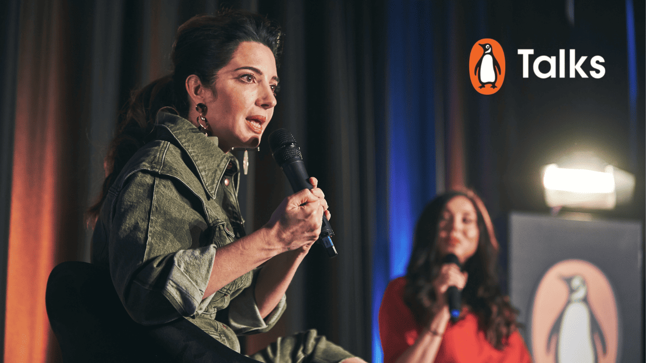 Marie Forleo and Cash Carraway speaking at penguin event
