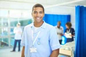 proud young student nurse on the ward